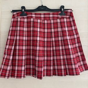 It is plaid pleated mini skirt. It is very good item for preppy looks. Like NEW!